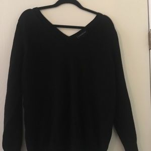 Black, double v-neck sweater from Lane Bryant.